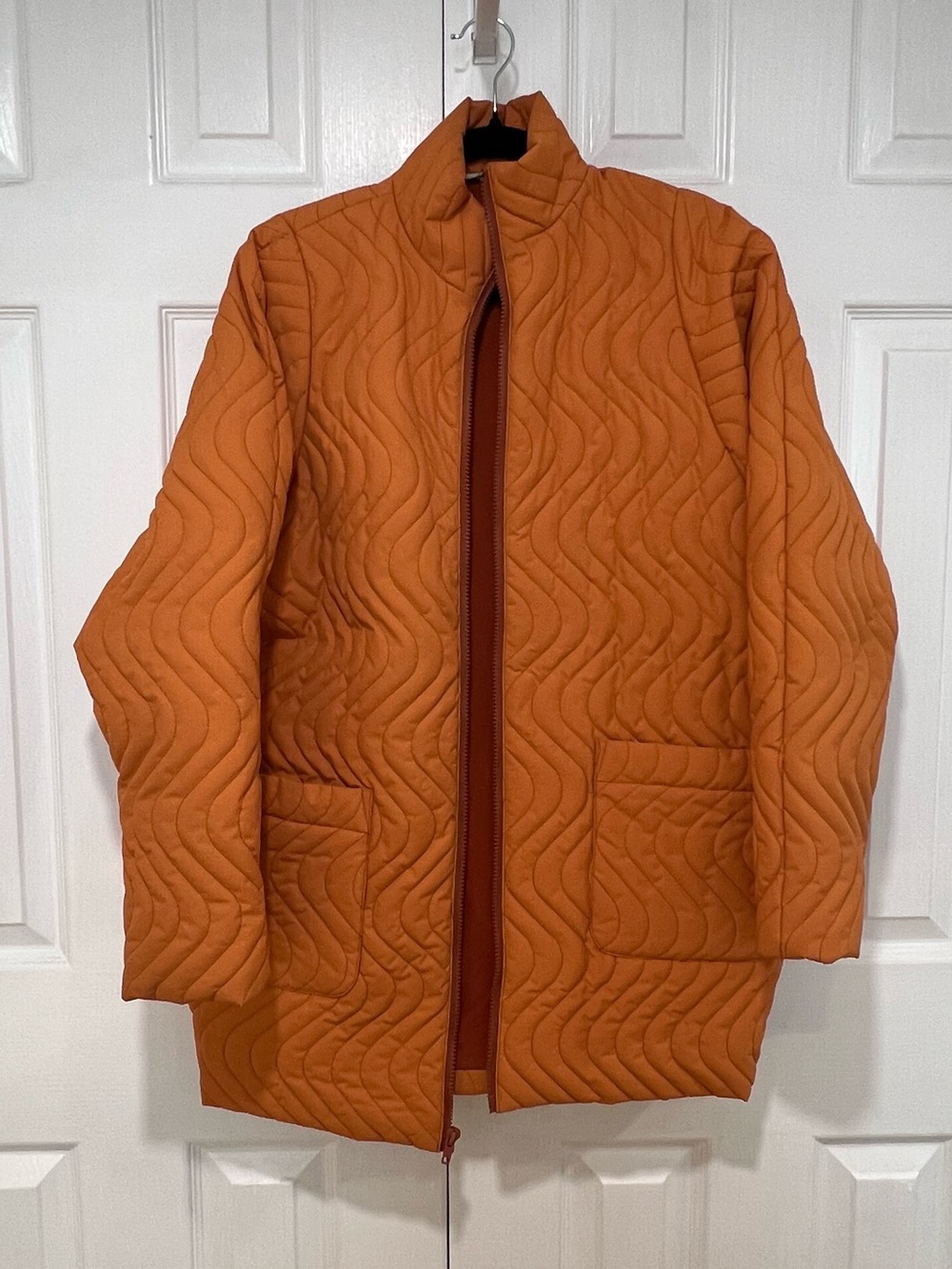 Orange quilted jacket